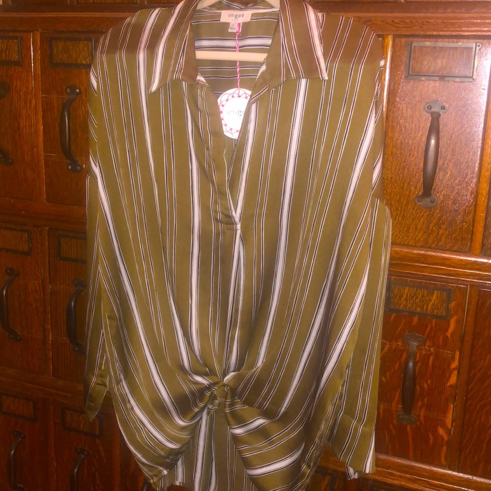 Long sleeve lightweight blouse. Moves well when wearing.
